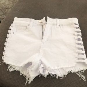 White jean shorts with cut out sides
